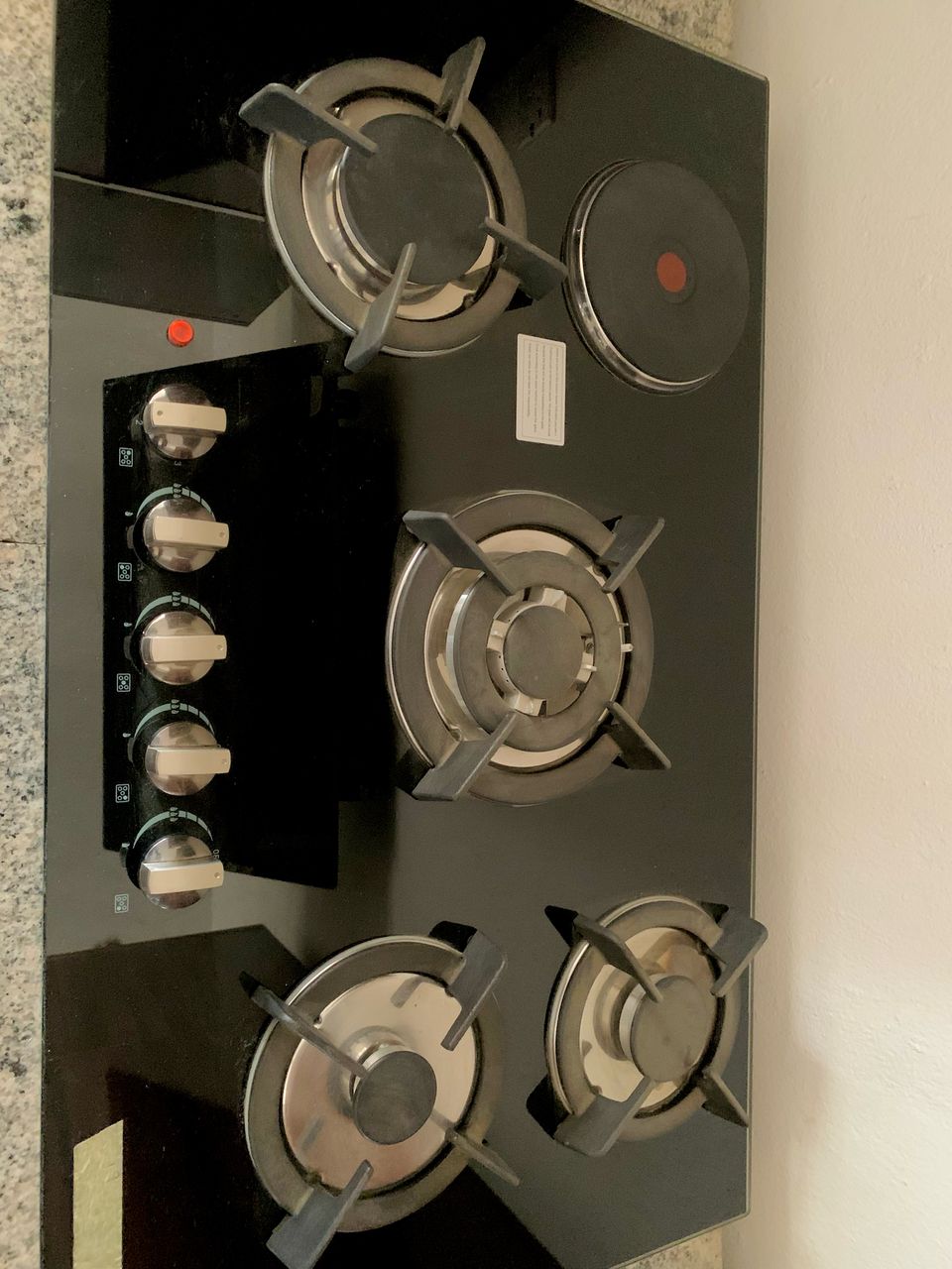 Installed 4-burner hybrid cooktop with side controls