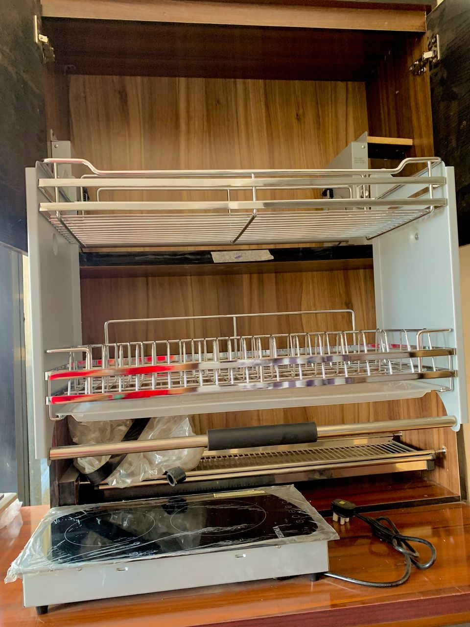 Pull-out stainless steel dish drying rack with induction cooker